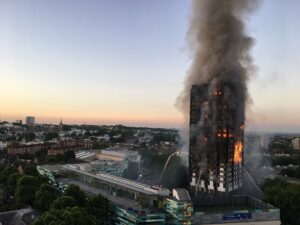 1024px-Grenfell_Tower_fire_(wider_view) by Natalie Oxford via wikimedia commons